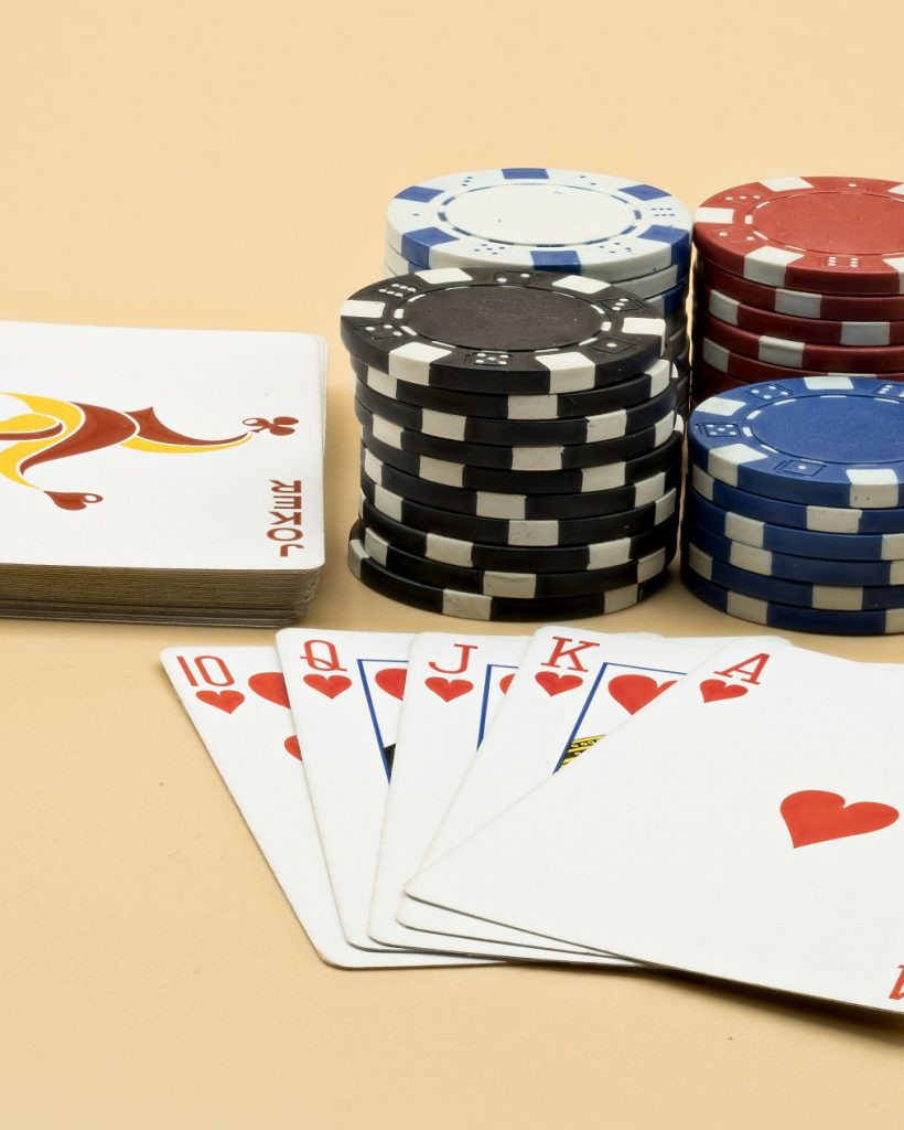 A collection of vibrant casino chips and playing cards